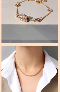 Detail of rose gold beaded bracelet and gold rope chain necklace on a female model