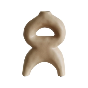 Modern Morandi ceramic art vase with abstract torso design in matte beige finish