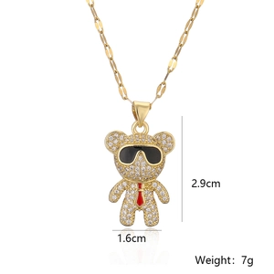 Detail shot of a gold bear pendant with zirconia, size 2.9x1.6cm, weighing 7g