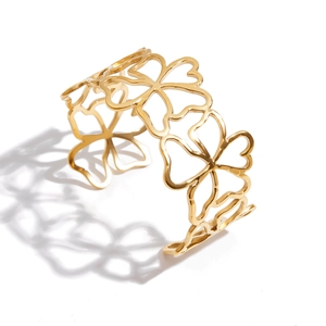 Polished 18k gold plated hollow flower open cuff bracelet in stainless steel
