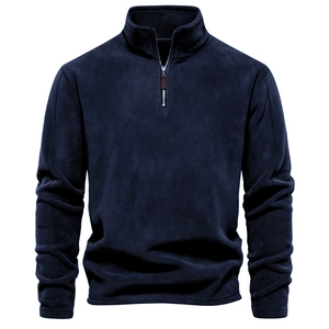 Detail of navy polar fleece fabric with half-zip stand collar and textured finish
