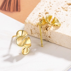 Irregular golden twisted flower stud earrings with a high-polish geometric ribbon design