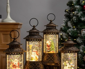Detail of vintage bronze Christmas lantern with LED snow scene and Santa Claus figurine