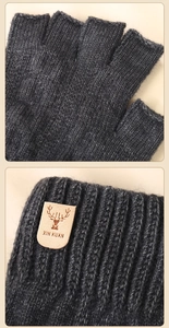 Detail of grey knitted fingerless alpaca wool glove with leather deer logo patch