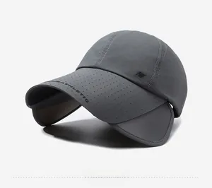 Detail of dark grey sun hat featuring retractable brim and laser-cut ventilation holes