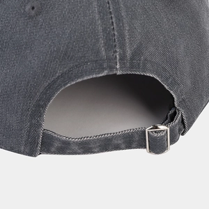 Close-up of charcoal gray baseball cap showing silver metal buckle and fabric texture