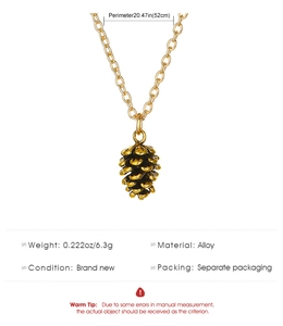 Detail view of retro gold pine cone necklace showing 52cm chain and 6.3g weight