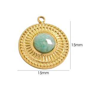 Detail of a 15mm gold-plated sunburst pendant with centered green natural stone
