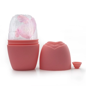 Pink rose silicone ice face roller open with frozen petals and a small funnel accessory