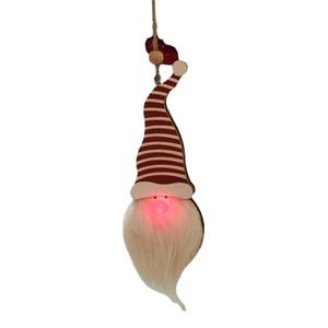 Hanging glowing Christmas gnome ornament with red striped hat and warm light nose