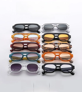 Close-up of retro square sunglasses in ten colors featuring a textured double bridge design