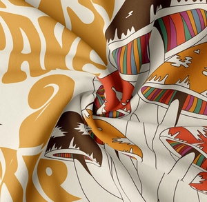 Close-up of vintage mushroom tapestry showing twill weave texture and artistic folded fabric