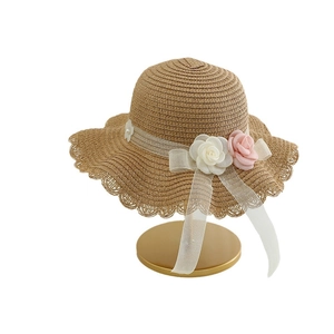 Girls straw sun hat with wavy brim and sweet floral ribbon decor for outdoor sun protection