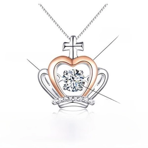 Detail of crown heart pendant featuring cubic zirconia and rose gold plating