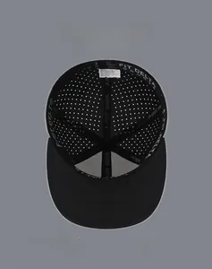 Detail view of the laser-cut ventilation holes and reinforced webbing inside the flat brim hip hop cap