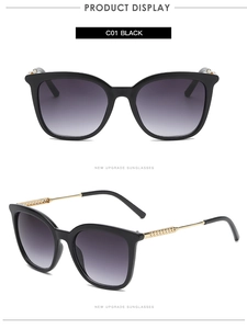 Detail view of retro hollow metal hinges and sleek black frames on trendy sunglasses