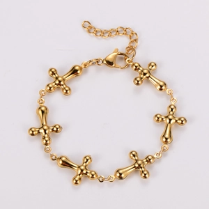 Detailed close-up of golden stainless steel cross link bracelet with lobster clasp