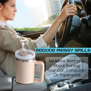 Pink tumbler in car cup holder with cute rainbow straw cover for spill protection