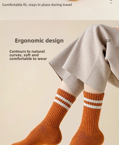 Detailed knit texture of ginger orange wool crew socks with white double stripes