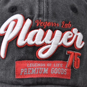 Dark grey washed cotton baseball cap with 3D Player 75 embroidery and premium labels