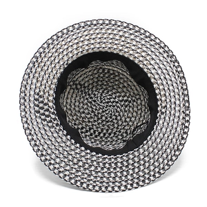 Detail of two-tone woven boater hat with inner sweatband and textured straw finish
