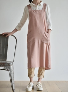 Close-up of pink linen apron featuring two large front pockets in minimalist Japanese style