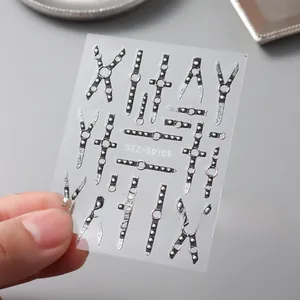 Macro detail of 5D embossed punk nail stickers with silver rivets and buckle designs