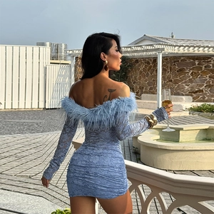 Detail of light blue lace bodycon dress featuring an off-shoulder faux fur collar and trim