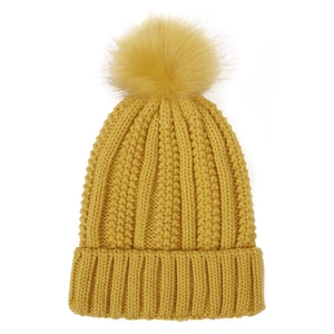 Detail of mustard yellow knit beanie with thick ribbed texture and faux fox fur pompom