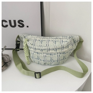 Detail of light green corduroy checkered waist bag with adjustable strap and buckle