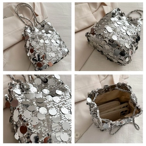 Detail of silver sequin bucket bag featuring large metallic discs and woven strap