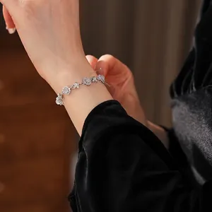 Elegant silver bracelet with micro-paved star elements and white round chalcedony stones