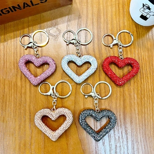 Set of hollow heart-shaped keychains with sparkling rhinestones in five diverse colors