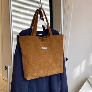 Brown corduroy tote bag with large capacity and FASHION label for daily styling