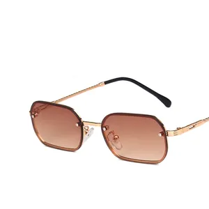 Vintage metal frame sunglasses with gradient brown lenses and twisted golden temples