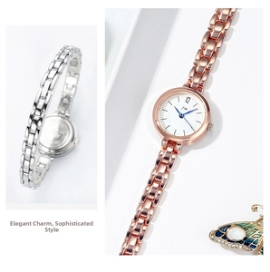 Detailed view of women's quartz chain watches in rose gold and silver with butterfly charm
