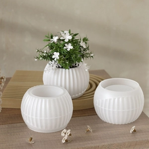 Detailed view of striped silicone molds for resin plant pots and candle holders