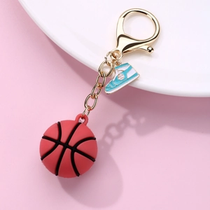 Creative PVC sports keychain featuring a mini red basketball and blue metal sneaker charm