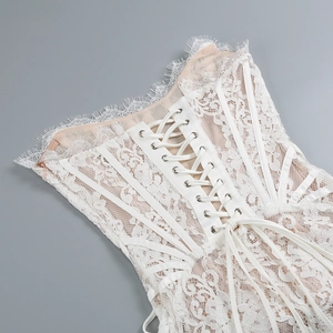 Detailed macro view of ivory lace corset back with adjustable ribbon lacing system