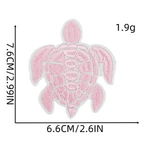 Size chart for pink turtle embroidery patch showing dimensions 7.6cm by 6.6cm in detail