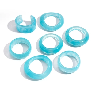 Minimalist light blue resin bangle and rings set with natural marble pattern textures