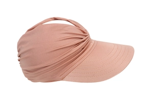 Detail of pink knitted sun hat showing textured fabric and precision stitching on brim
