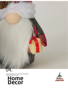 Detail of Christmas gnome with grey felt hat, pine cone accent and yellow gift box