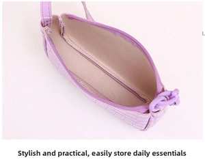 Detail of light purple crocodile pattern hobo bag showing interior lining and zipper