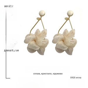 Detail view of large white fabric flower earrings with S925 silver needles and crystals