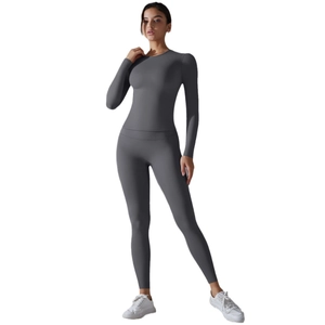 Women's dark grey high-stretch yoga set with long sleeve top and high waisted leggings