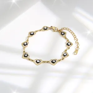 Golden heart evil eye bracelet for women with elegant adjustable link chain