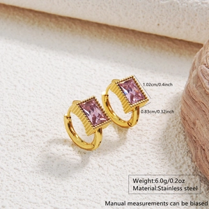 Macro shot of gold stainless steel huggie earrings with pink faceted stones and dimensions