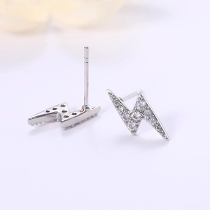 Macro shot of silver lightning bolt earrings with pavé cubic zirconia inlay detail