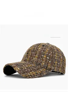 Close-up of coffee brown tweed texture and woven pattern on autumn baseball cap